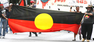 Activists in Australia March with Aboriginal Flag