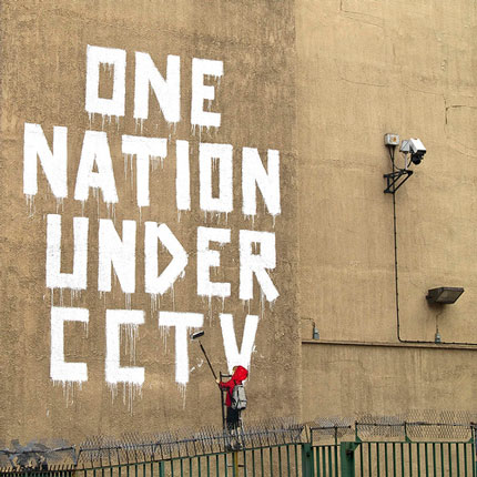 Graffiti artist Banksy strikes under an ever-snooping eye in central London to make point about the increasing surveillance of public spaces.