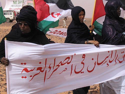 Saharawi women protest near the Moroccan-built wall that divides Western Sahara.