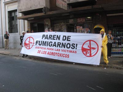 Activists in Asunción hold sign against pesticide use