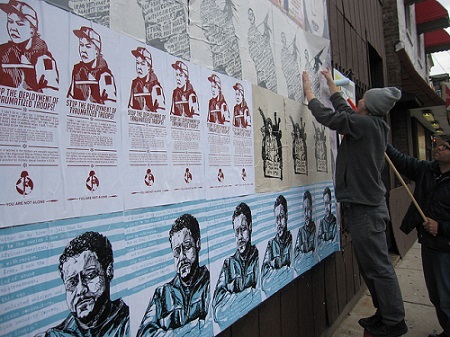 Putting up Iraq Veterans Against the War Posters in Chicago