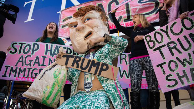 Donald Trump impersonator Tighe Barry leads pro-refugee activists in rally against Trump. Photograph: Jeff Malet/Sipa/Rex Shutterstock