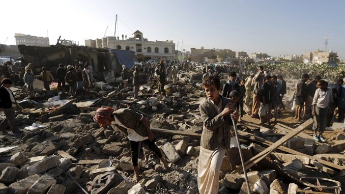 People searching through the rubble at site of Saudi air bombing in Yemeni capital of Sana’a. (Photo by Khaled Abdullah Ali/Reuters)