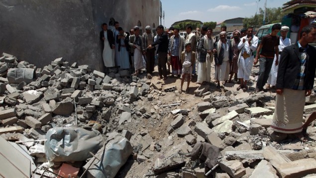 Yemenis gather near the Sanaa Aiport, bombed in March of 2015 by Saudi warplanes. (Credit: AFP/Mohammed Huwais)