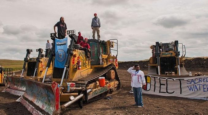 Protesters taking direct action to stop work on the Dakota Access oil pipeline. (Credit: Reuters, A. Cullen)