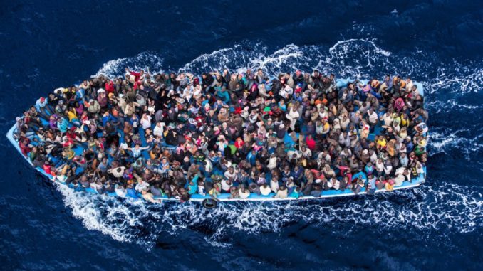 Italian navy rescues asylum seekers traveling by boat off the coast of Africa on June 7, 2014. (Massimo Sestini/Polaris)