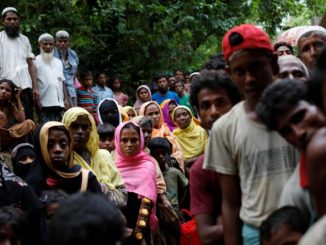 Rohingya refugees wait for food near Kutupalong refugee camp after crossing the Bangladesh-Burma border in Ukhia Danish Siddiqui/Reuters