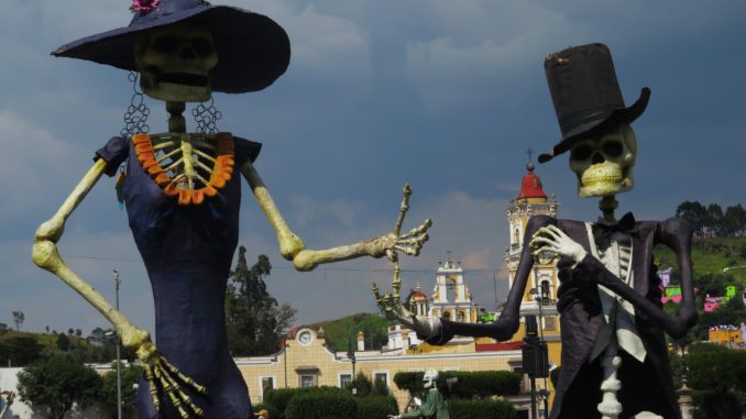 A Catrina statue (left) on display in Toluca, for the alfeñique festival. Credit: Tamara Pearson