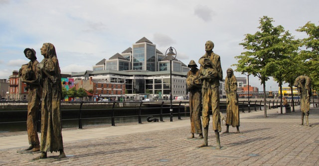 Famine persists with opulent power behind it: “The Famine” sculpture in Dublin, Ireland by Rowan Gillespie. (Credit Christine Mitchell CC BY-SA 2.0)