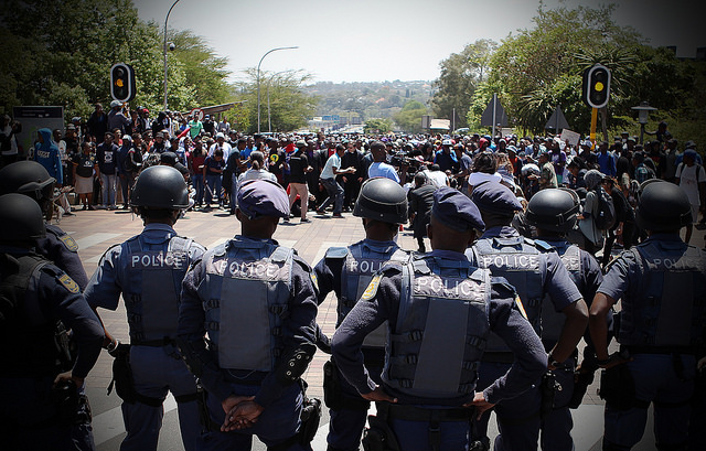 Police face off with student protesters in Pretoria, South Africa, on October 20, 2016. Credit: Denvor DeWee/IPS
