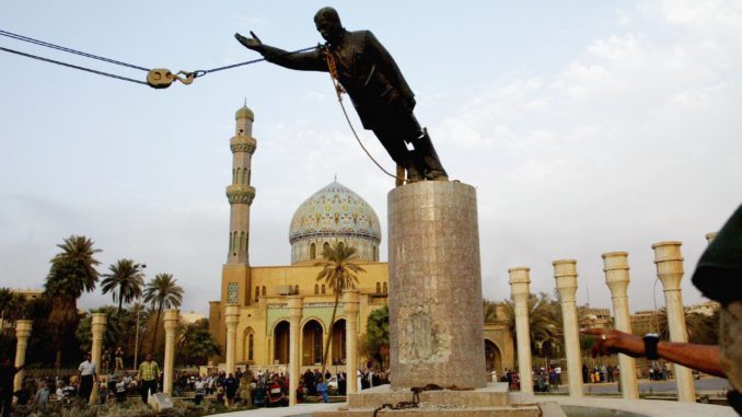 U.S. Marines pull down the statue of Saddam Hussein in the center of Baghdad, April 9, 2003. Credit: Mirrorpix/Getty Images