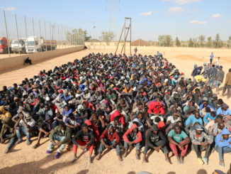 Migrants sit at a detention center in Gharyan, Libya October 12, 2017. Credit: Reuters/Hani Amara