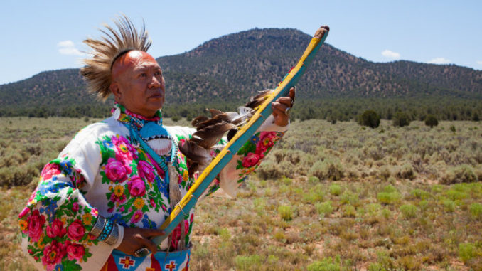 Uqualla, a Havasupai Medicine Man and Spiritual Traditionalist, stands in front of Red Butte. Photo Garet Bleir
