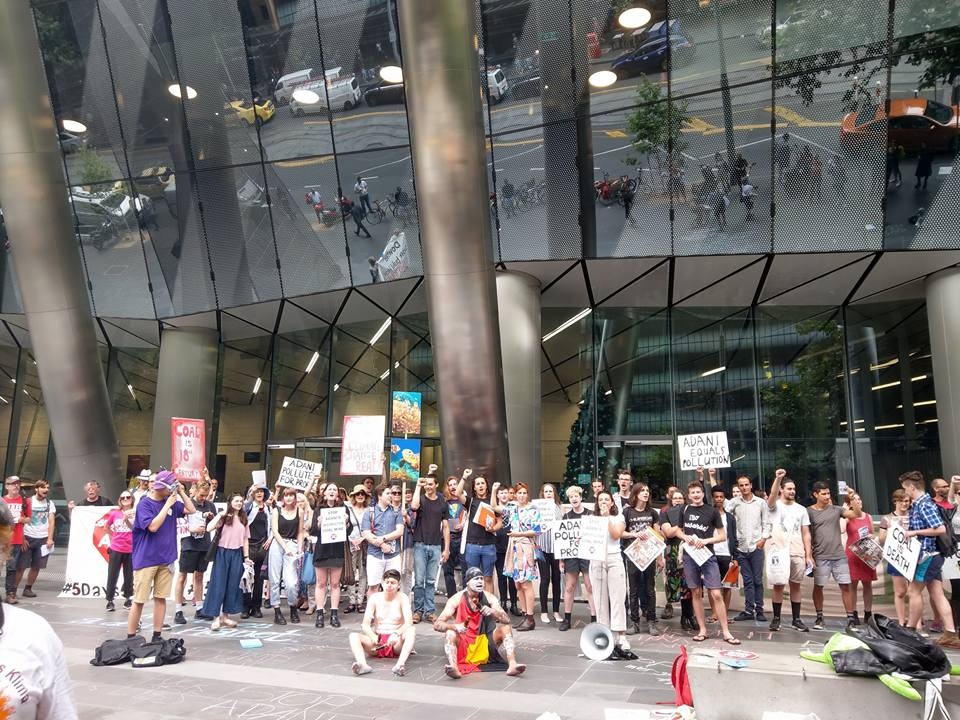 A few of the over the 150 activists who attended the protest in front of Downer's corporate headquarters demanding the company cease working on the coal mine in Queensland. (Photo courtesy of Zianna Fuad)