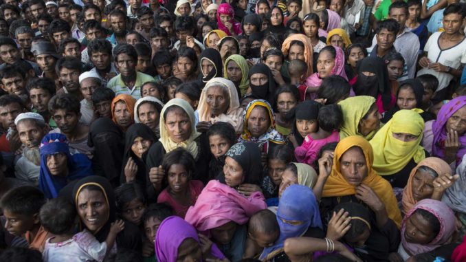 Rohingya gather for aid handouts of clothing and food on in Tankhali, Bangladesh. (Paula Bronstein/Getty Images)