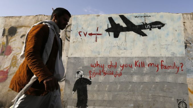 Graffiti denouncing strikes by U.S. drones in Yemen, painted on a wall in Sanaa.(Reuters/Khaled Abdullah)