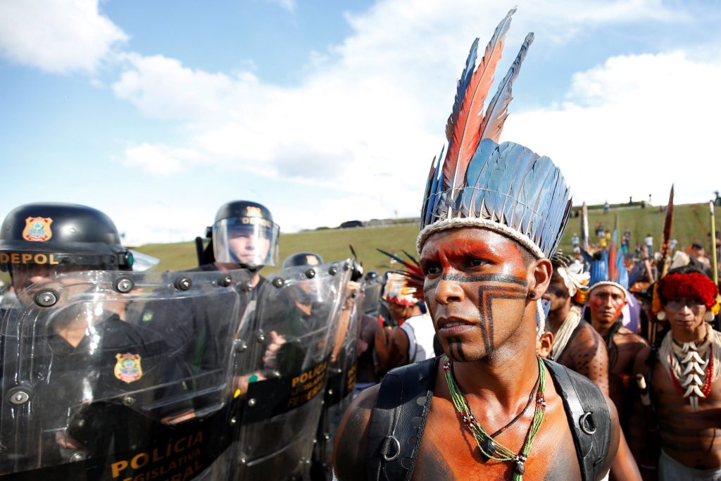 People from various indigenous groups gathered in the Brazilian capital in April, 2017 to demand the demarcation of their land in a protest that led to confrontations with the security forces in front of congress. Photo by Gregg Newton/Reuters