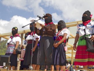 Zapatista women take the stage to deliver their speeches collectively from each Caracol, or administrative center. (WNV/Shirin Hess)
