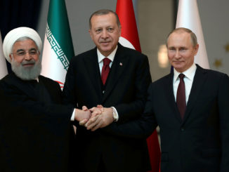 Presidents Hassan Rouhani of Iran, Tayyip Erdogan of Turkey and Vladimir Putin of Russia pose before their meeting in Ankara, Turkey, April 4, 2018. Photo credit: Tolga Bozoglu/Pool via Reuters