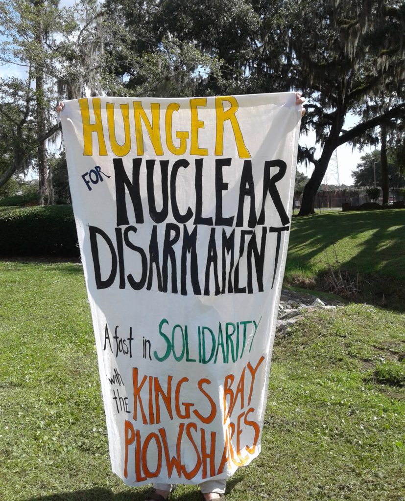 Banner held outside of Nuclear Submarine Base, King’s Bay. Photo credit: Beth Brockman