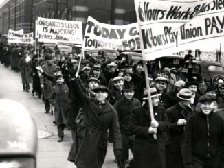 Union demonstrators march outside the Fleetwood and Cadillac plan in Detroit and a General Motors strike in 1936. Credit: The Detroit News