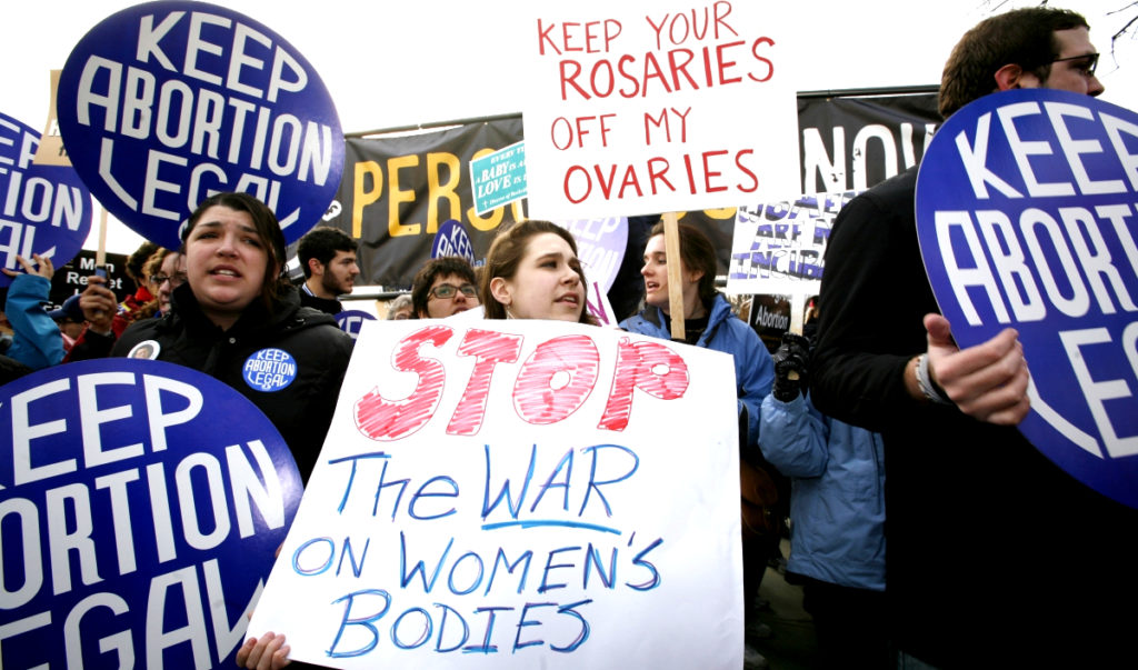 Pro-choice activists demonstrate during March for Life Fund's 37th annual march marking the anniversary of the Supreme Court's 1973 Roe v. Wade abortion decision in Washington January 22, 2010. Photo credit: Molly Riley/Reuters