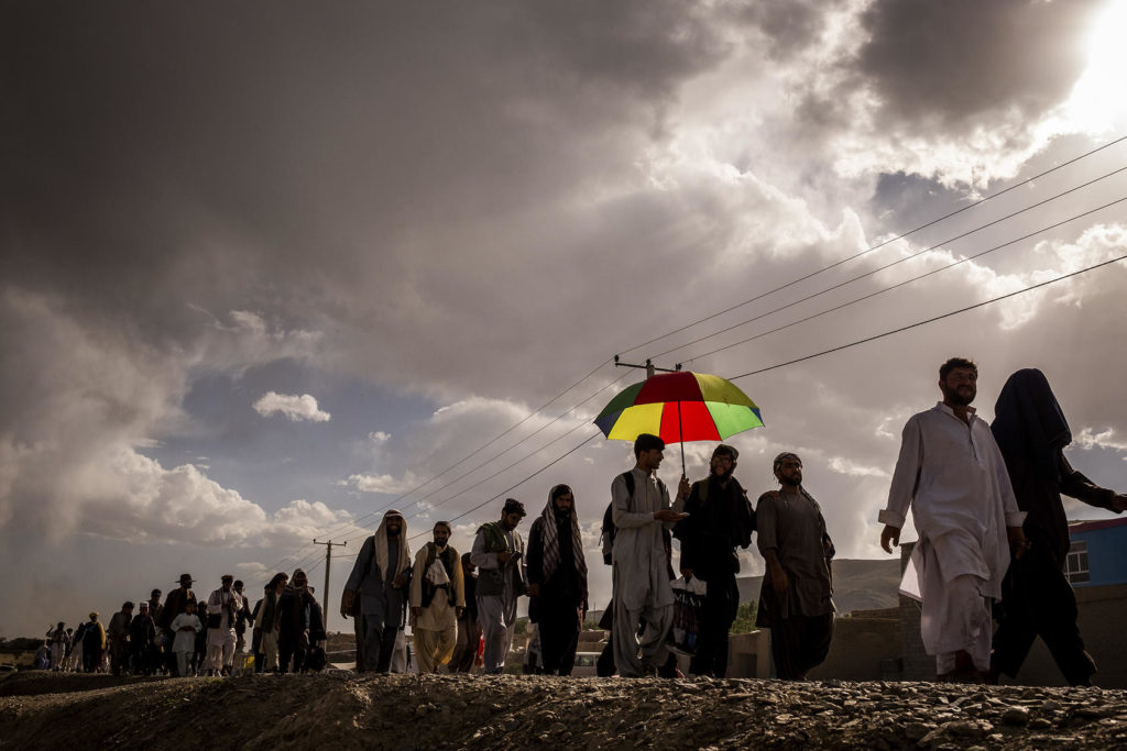 Members of the peace march walk to the edge of Ghazni, Afghanistan on June 11, 2018. Photo credit: Jim Huylebroek/The New York Times