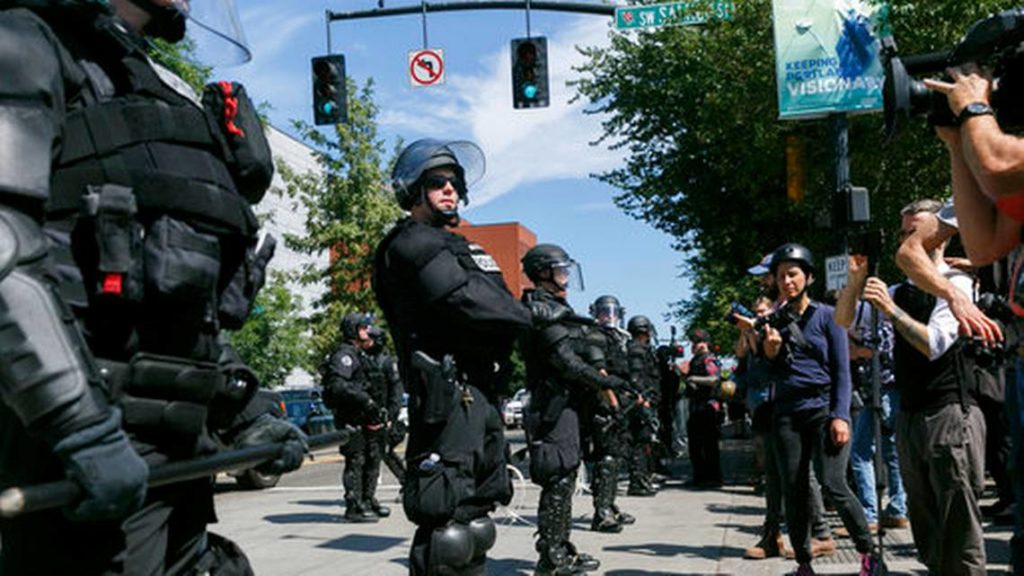 Portland police during a rally in Portland, Ore., Saturday, Aug. 4, 2018. Photo credit: AP/John Rudoff