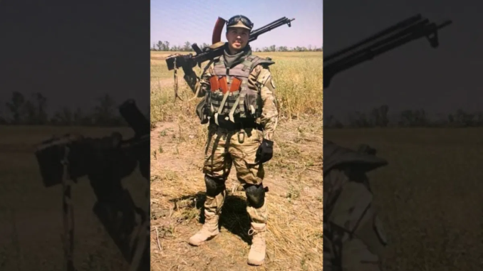 Belarusian regime-change activist Roman Protasevich armed with an assault rifle in a neo-Nazi Azov Battalion uniform in Ukraine / credit: <a href="https://thegrayzone.com/2021/05/26/belarus-roman-protasevich-plane-nazis-ukraine/" target="_blank" rel="noopener">The Grayzone</a>