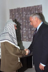 Former Israeli Prime Minister Benjamin Netanyahu's first meeting with Palestinian President Yasser Arafat at the Erez crossing, September 4, 1996 / credit: Israel Government Press Office