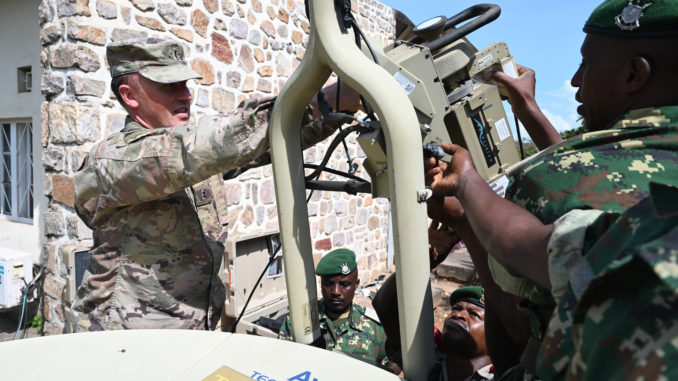 U.S. and Burundi soldiers dismantle a SIPR NIPR Access Point Terminal (SNAP) at the Burundi National Defense Headquarters on May 19, 2021 / credit: Staff Sgt. Melissa Sterling