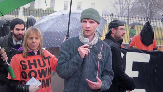 Drone whistleblower Daniel Hale (right) stands next to CodePink co-founder Medea Benjamin outside the White House in Washington, D.C., in this undated photo / credit: Democracy Now!