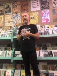The author of this review, Matt Dineen, hosting an event at Wooden Shoe Books and Records in Philadelphia. Dineen was quoted in the book, The Radical Book Store" / credit: Matt Dineen