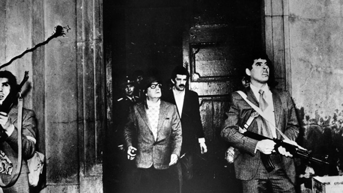 The last photograph of Chilean President Salvador Allende on September 11, 1973, inspecting La Moneda, the presidential palace, shortly before his death