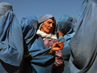 Afghan women line up at a World Food Program distribution point / credit: United Nations photo licensed under CC BY-NC-ND 2.0
