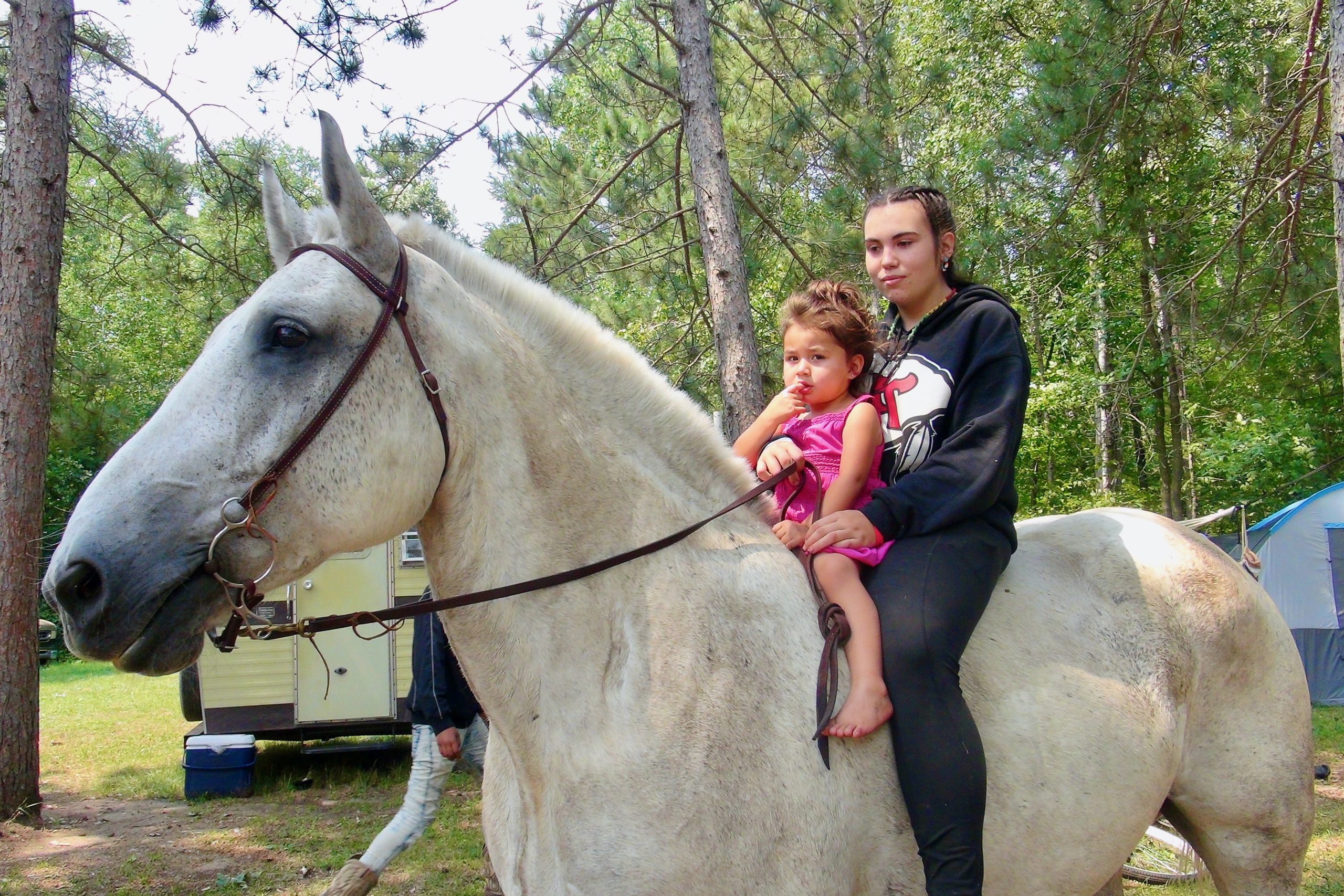 Kiley Knowles (right) and Nova Dakota on a horse named Bud at Shell City Horse Camp.