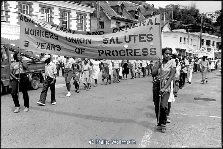 Workers with a trade union banner march in 1982 through St. Georges, the Grenadian capital, to mark the 3rd anniversary of the 1979 New Jewel Movement revolution / credit: Philip Wolmuth