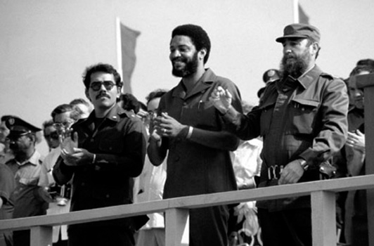 Grenadian President Maurice Bishop (center) with Nicaraguan President Daniel Ortega (left) and Cuban President Fidel Castro at a May Day celebration in Grenada on May 1, 1980