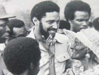 Grenadian Prime Minister Maurice Bishop with a woman of the Carriacou island.