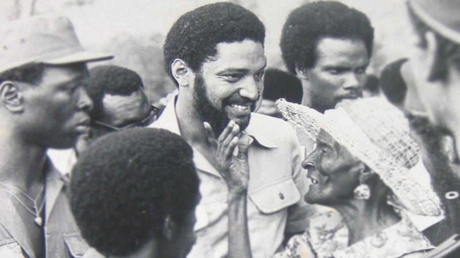 Grenadian Prime Minister Maurice Bishop with a woman of the Carriacou island.