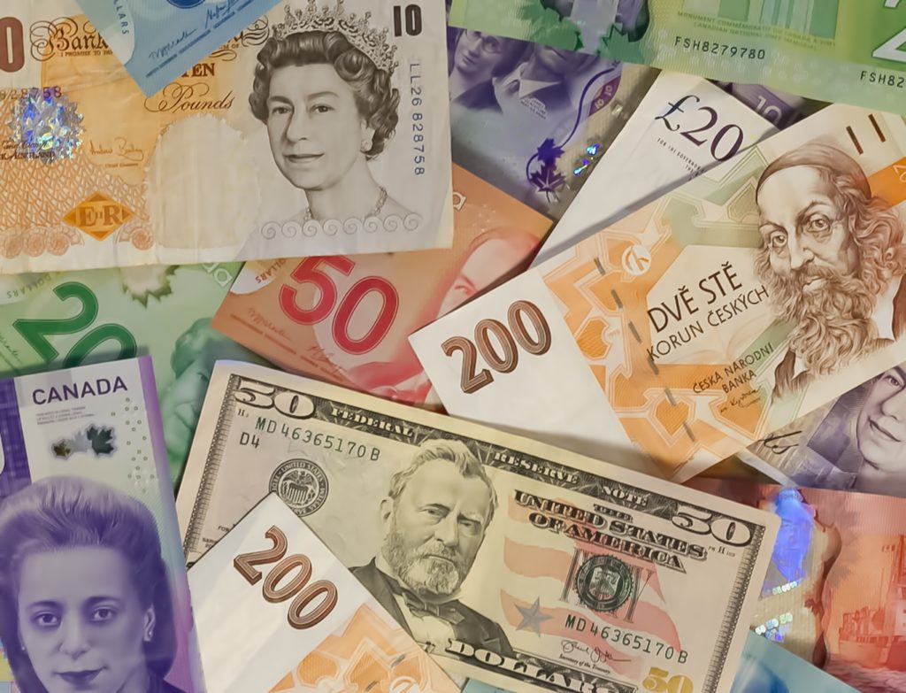 An image of U.S. dollar bills, Canadian dollars, U.K. pound sterlings. Developed countries are required to fund climate-change mitigation and adaption efforts of developing countries / credit: <a href="https://unsplash.com/@snowjam?utm_source=unsplash&utm_medium=referral&utm_content=creditCopyText">John McArthur</a> on <a href="https://unsplash.com/s/photos/printing-money?utm_source=unsplash&utm_medium=referral&utm_content=creditCopyText">Unsplash</a>