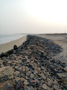 A geotextile tube (engineered coastal defense mechanism) located in the state of Odisha, along India's eastern coast, to keep out rising sea levels caused by climate change / credit: Rishika Pardikar