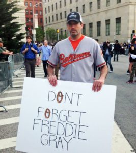 A demonstrator raising awareness of the death of Freddie Gray in Baltimore in April 2015 / credit: Voice of America