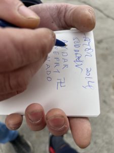 Alec Shevchenko, a 70-year-old Ukrainian refugee, grabbed this reporter’s notebook, and wrote down in Roman letters: "AYDAR, AZOV, DNEPRI, TORNADO” / credit: Fergie Chambers