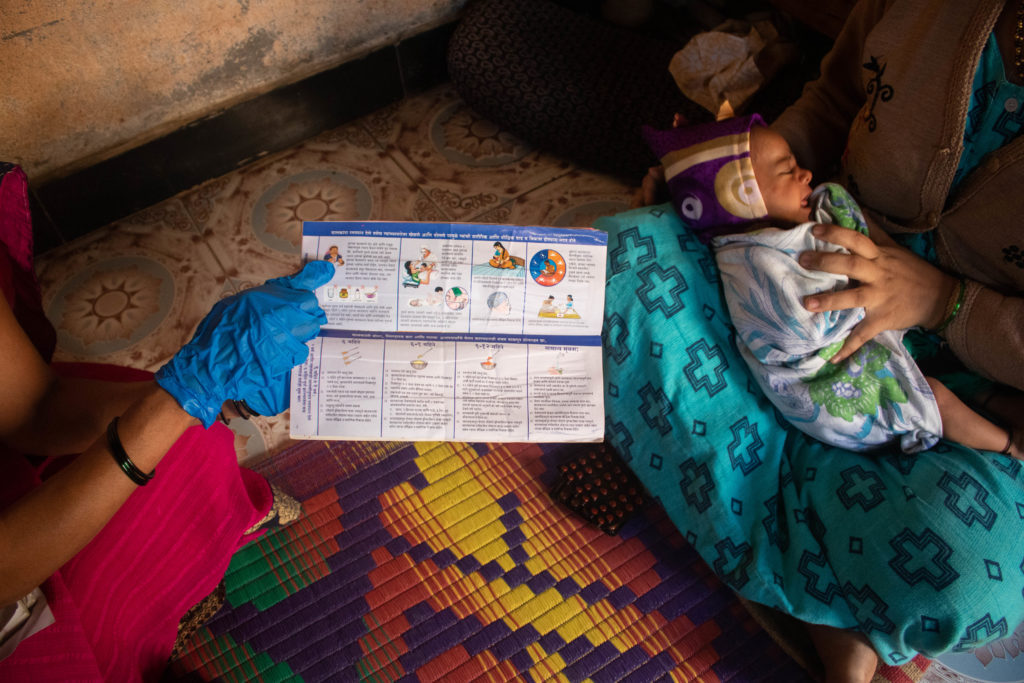 An ASHA worker explains breastfeeding and taking care of the newborn to a community woman in Maharashtra’s Khutwad village / credit: Sanket Jain