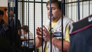 Ruslan Kotsaba in a cage during a recent court trial / credit: friendspeaceteams.org