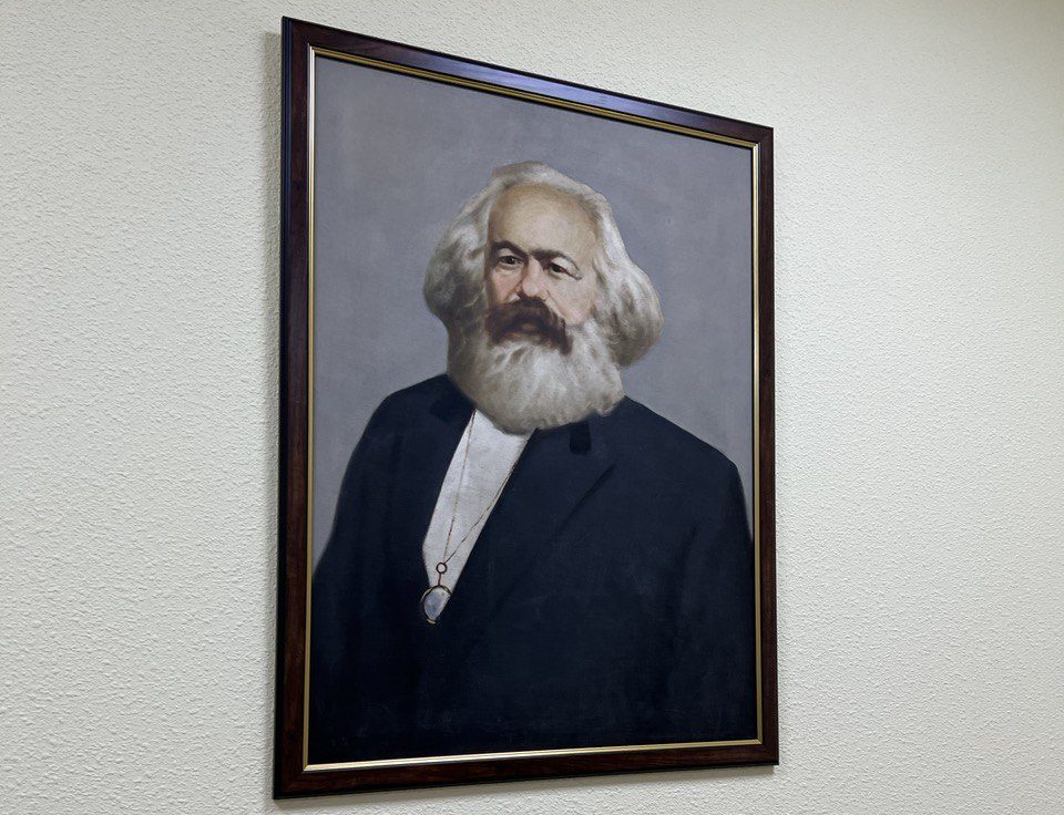 A photo of theorist and organizer Karl Marx on the wall of the KPRF office in Saint Petersburg / credit: Fergie Chambers