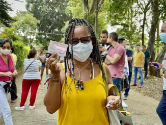 Charo Mina Rojas, a member of Proceso de Comunidades Negras, an alliance of Afro-descendant organizations in Colombia, shows her voter registration card after voting for Gustavo Petro on Sunday in the first round of the presidential election / credit: Julie Varughese