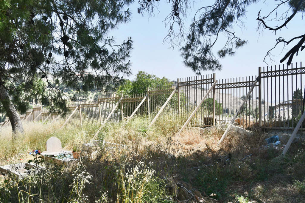 Israeli authorities erected a fence in 2021, dividing al-Yusufiya cemetery / credit: Jessica Buxbaum