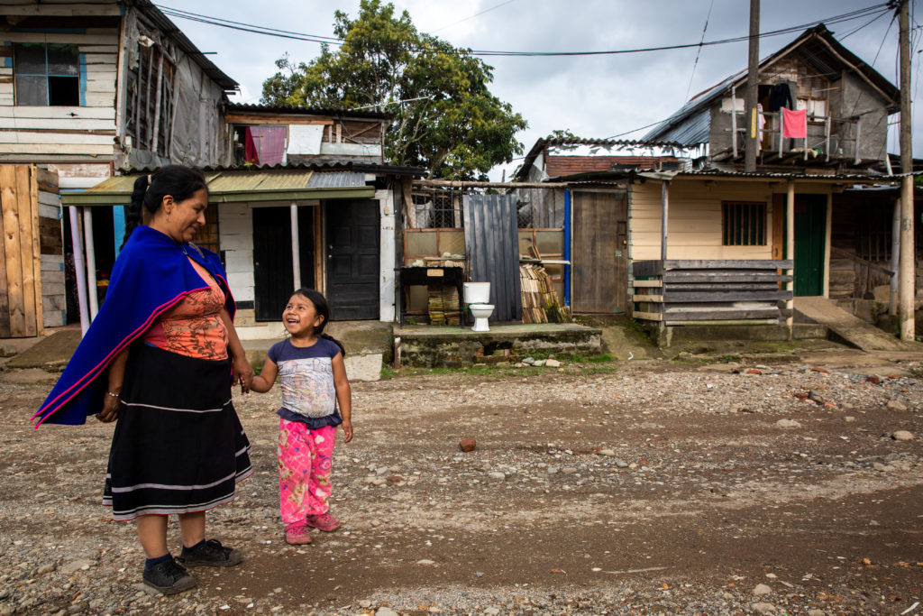 Clara Ines Yalanda, 36, and her 4-year-old daughter, Valentina, in front of their house in an informal settlement in Popayan, Colombia / credit: Antonio Cascio